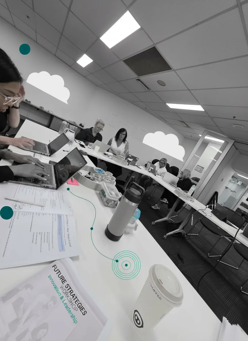 Participants working at laptops during the AI in Action lab